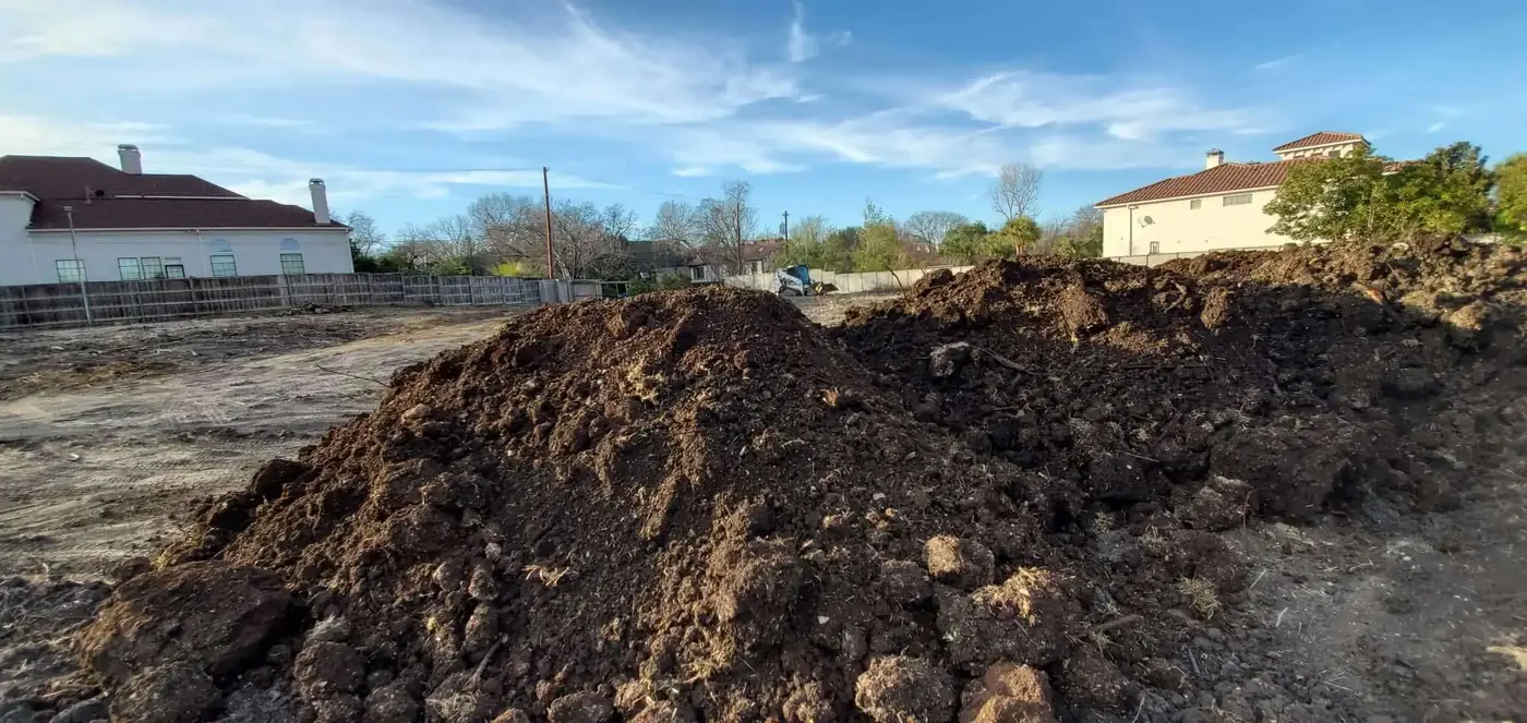 Bulk topsoil spread over a prepared lawn grade